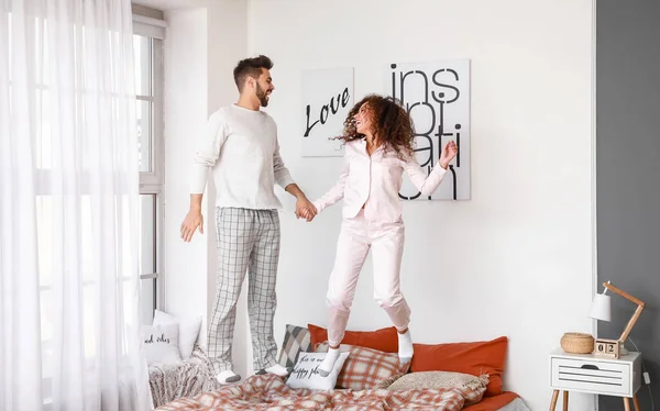 Happy Young Couple Jumping Bed Home — Stock Photo, Image