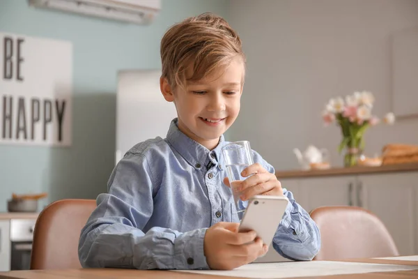 Cute Little Boy Mobile Phone Drinking Water Kitchen — Stock Photo, Image