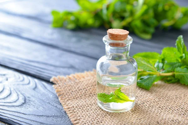 Bottle Mint Essential Oil Table — Stock Photo, Image