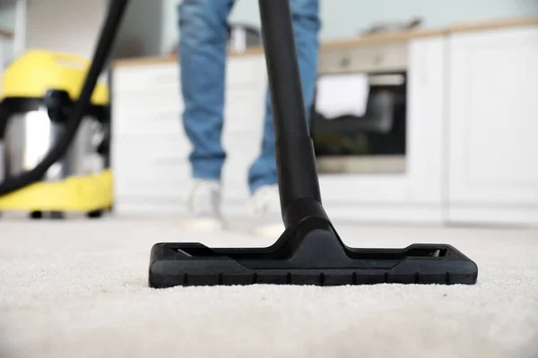 Young Man Hoovering Floor Kitchen Closeup — Stock Photo, Image