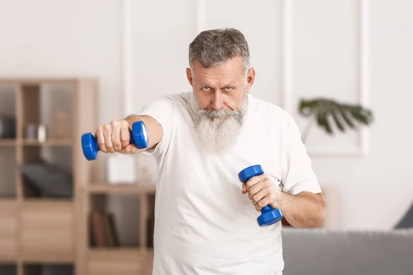 Sporty Elderly Man Training Dumbbells Home — Stock Photo, Image