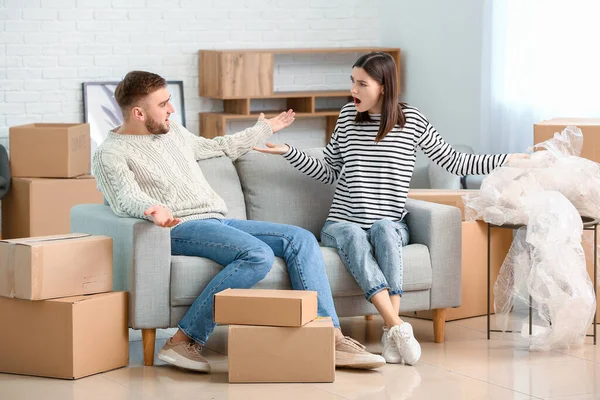 Young couple in their new flat on moving day