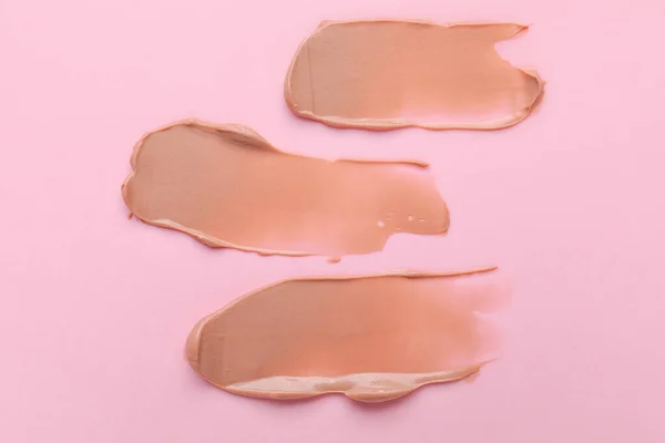 Samples of cream on color background