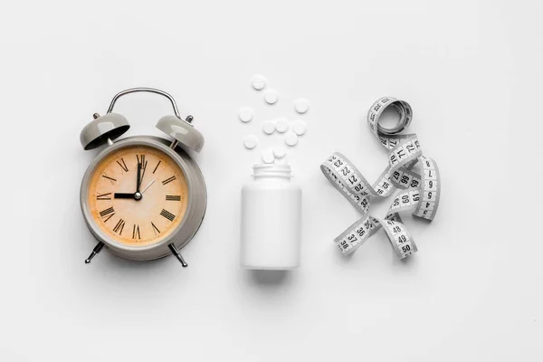 Bottle Weight Loss Pills Alarm Clock Measuring Tape White Background — Stock Photo, Image