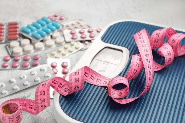 Weight Loss Pills Scales Measuring Tape Grey Background — Stock Photo, Image