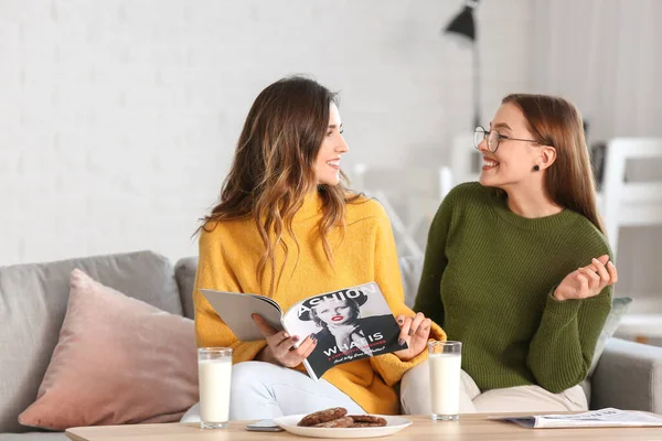 Young Women Warm Sweaters Reading Magazine Home — Stock Photo, Image