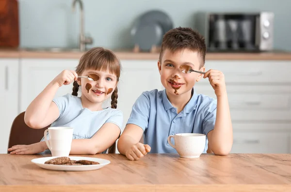 Cute Little Children Eating Melted Chocolate Kitchen — Stock Photo, Image