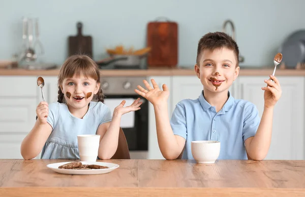 Cute Little Children Eating Melted Chocolate Kitchen — 스톡 사진