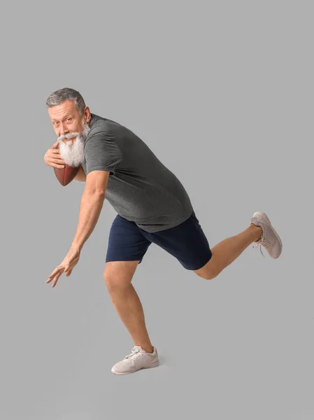 Sporty Elderly Man Rugby Ball Grey Background — Stock Photo, Image