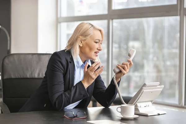 Stressed Mature Woman Being Informed Her Dismissal Phone — Stock Photo, Image