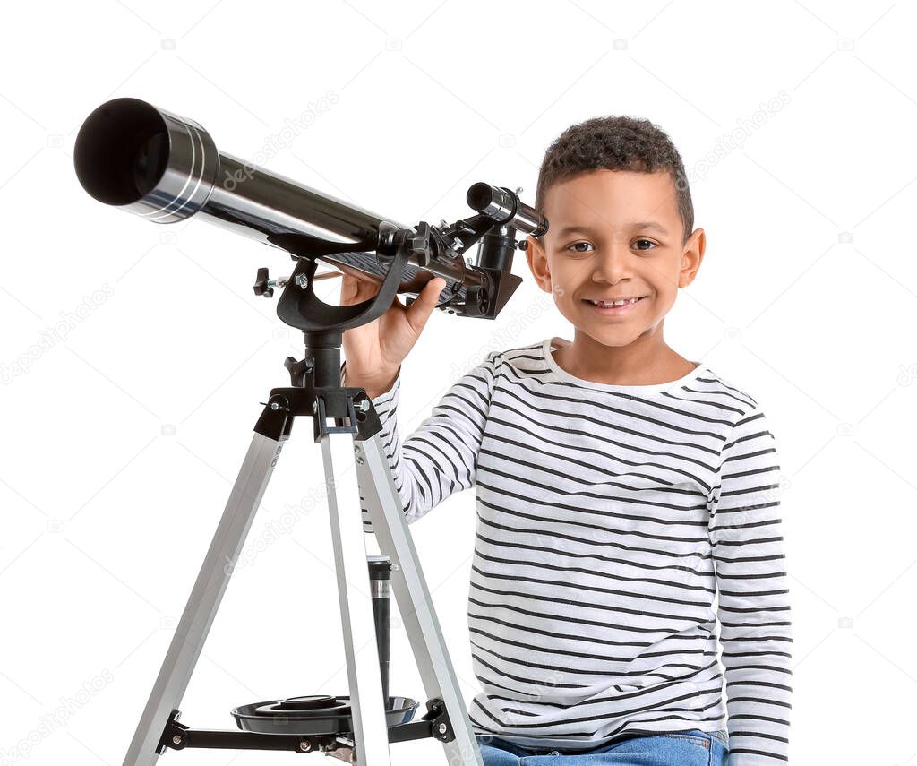 Little African-American boy with telescope on white background