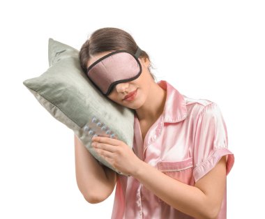 Beyaz arka planda hapları ve yastığı olan uyuyan kadın.