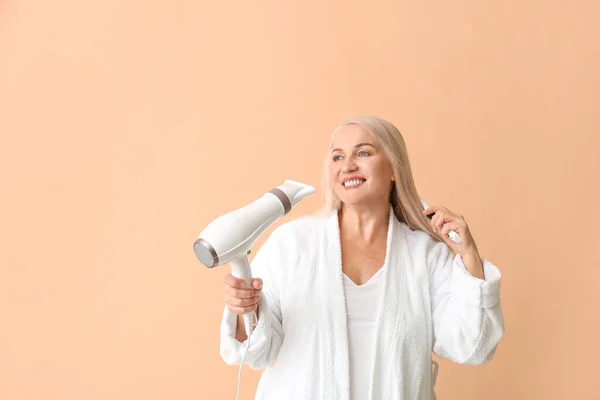 Beautiful Mature Woman Hair Dryer Color Background — Stock Photo, Image