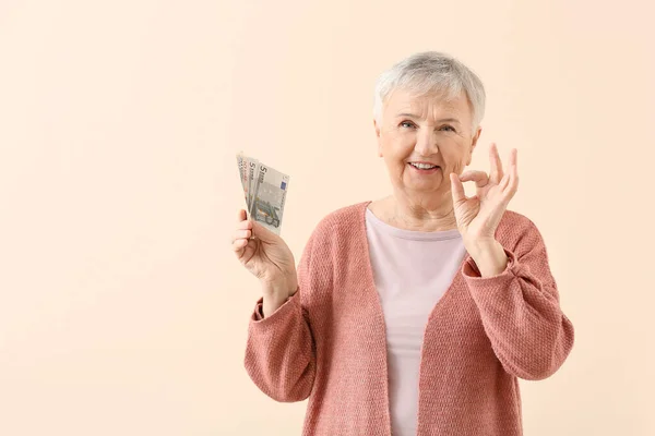 Senior Woman Money Showing Color Background — Stock Photo, Image