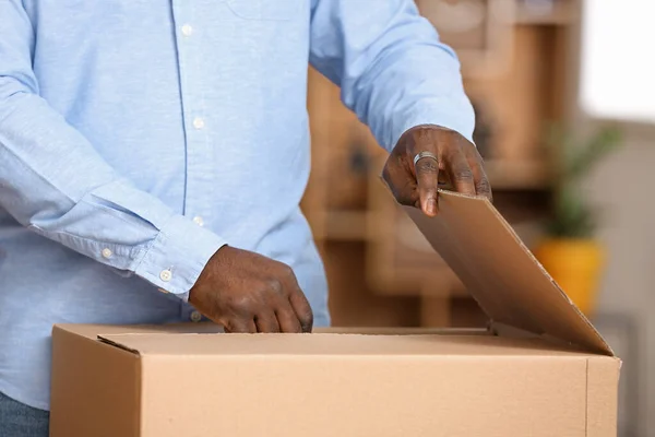 African American Man Unpacking Parcel Home Closeup — Stock Photo, Image