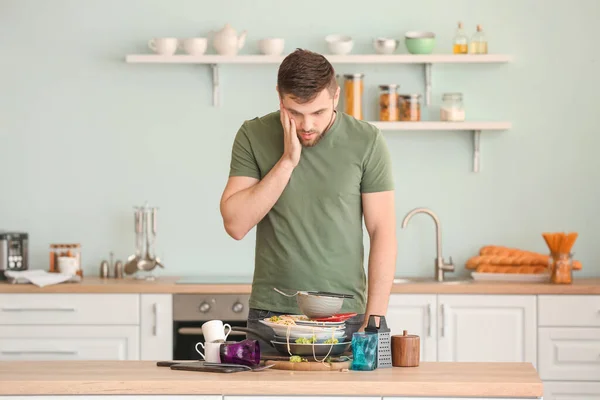 Shocked Man Looking Pile Dirty Dishes Kitchen Table — Stock Photo, Image