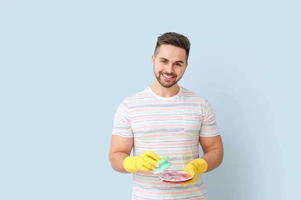 Young Man Dirty Dishes Sponge Color Background — Stock Photo, Image