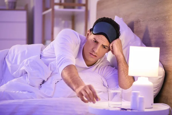 Young Man Taking Pills Insomnia Bedroom — Stock Photo, Image