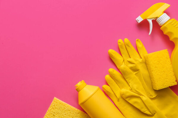 Set of cleaning supplies on color background