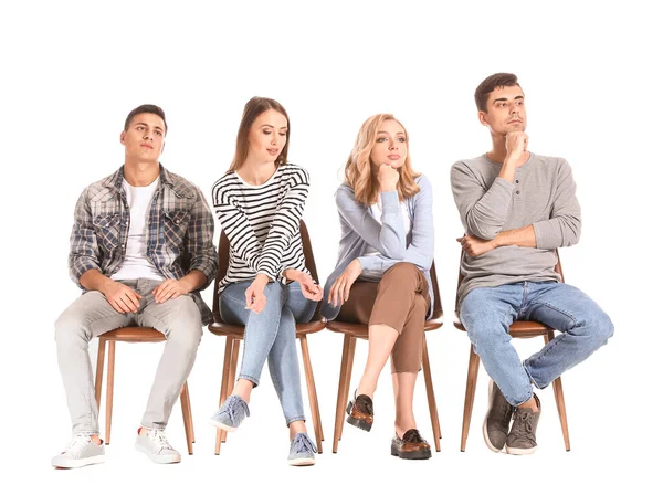 Young people waiting in line on white background