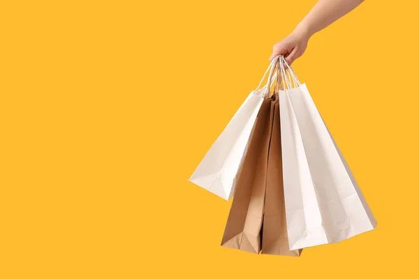 Female Hand Paper Shopping Bags Color Background — Stock Photo, Image