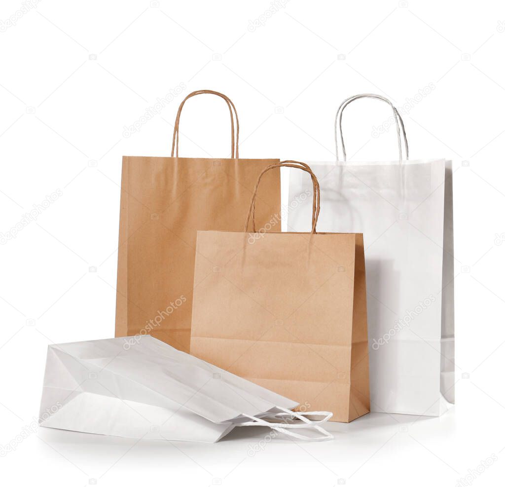Paper shopping bags on white background