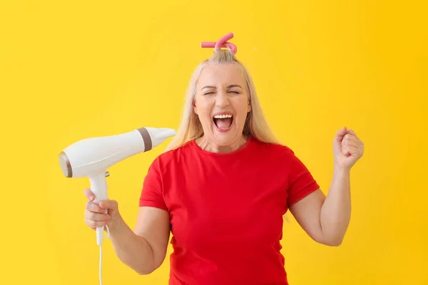 Emotional Mature Woman Hair Dryer Color Background — Stock Photo, Image