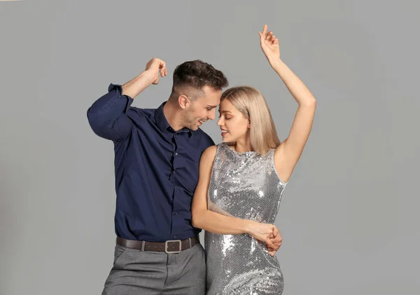 Happy Dancing Young Couple Grey Background — Stock Photo, Image