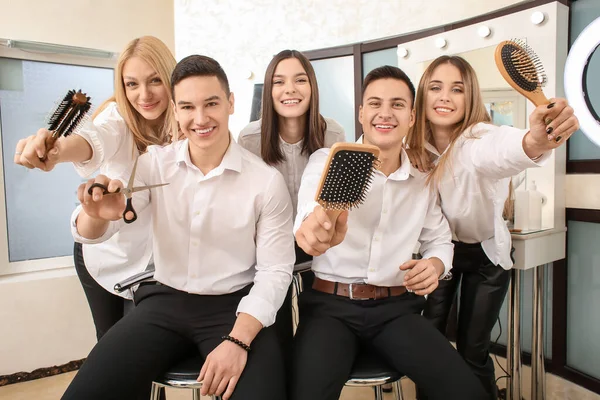 Young people during professional courses in hairdresser\'s salon