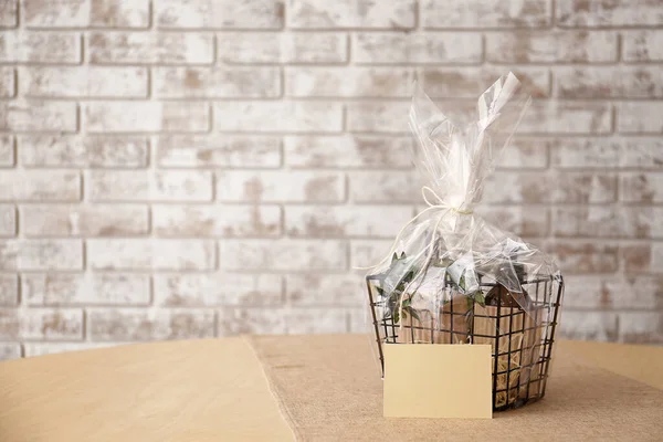 Basket with gifts for Mother\'s Day on table