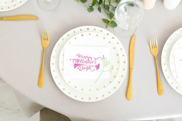Table setting with card for Mother\'s day dinner