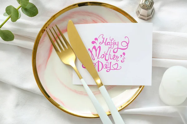 Table setting with card for Mother\'s day dinner