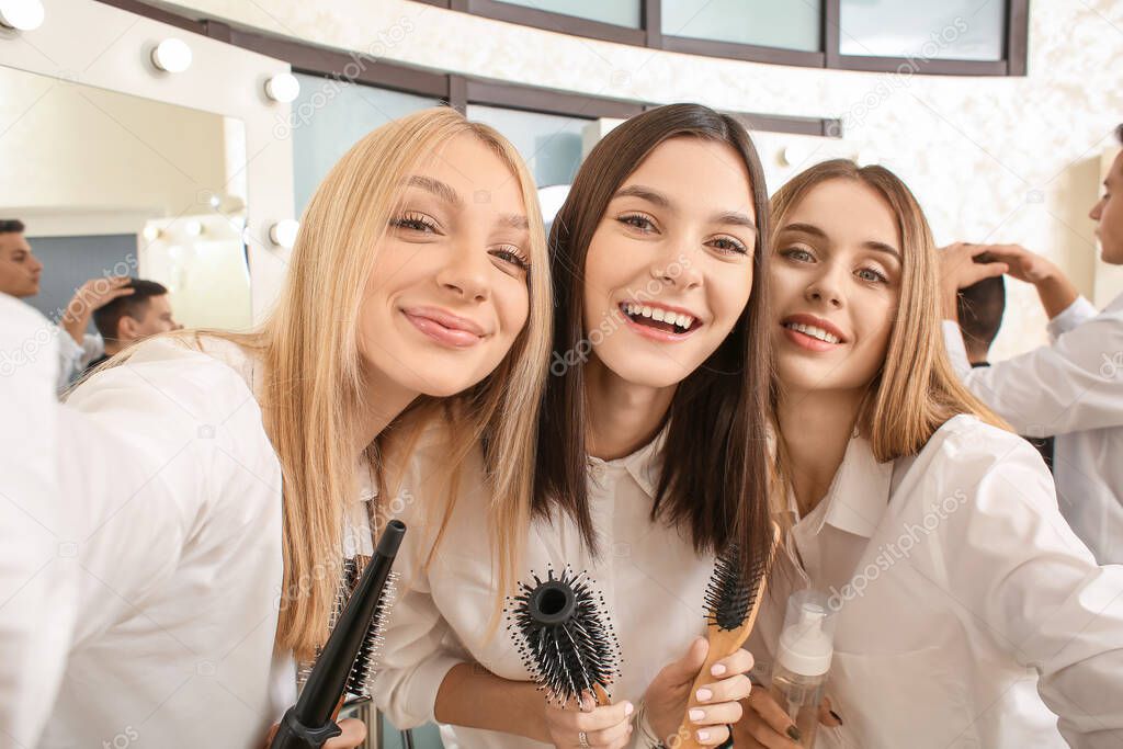 Young women during professional courses in hairdresser's salon