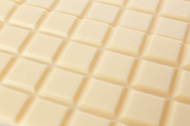 Tatlı beyaz çikolata arka planda, yakın plan