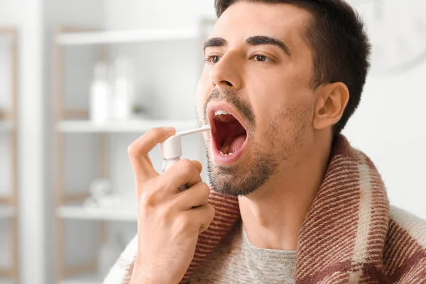 Ill Young Man Using Inhaler Home — Stock Photo, Image