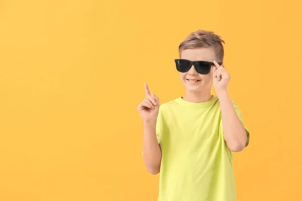 Cute Little Boy Sunglasses Raised Index Finger Color Background — Stock Photo, Image