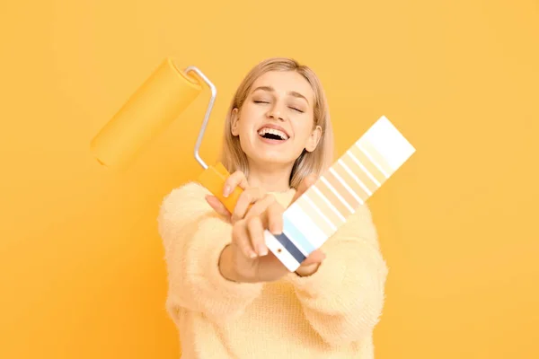 Young Woman Color Swatches Paint Roller Yellow Background — Stock Photo, Image