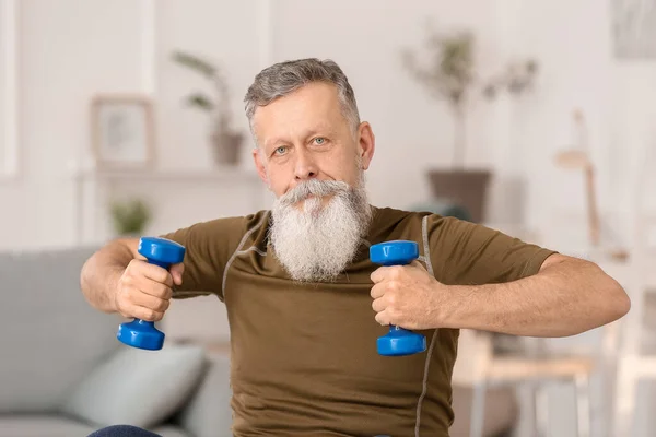 Sporty Elderly Man Training Dumbbells Home — Stock Photo, Image