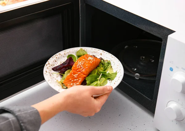 Woman Putting Plate Food Microwave Oven — Stock Photo, Image