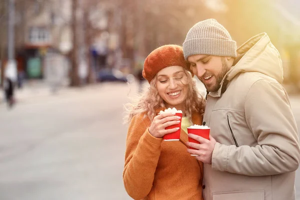 Happy Young Couple Drinking Hot Cocoa Outdoors — Stock Photo, Image