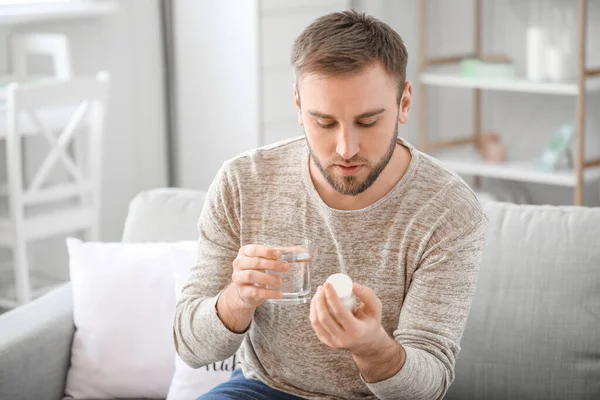 Young Man Taking Medicine Home — Stock Photo, Image