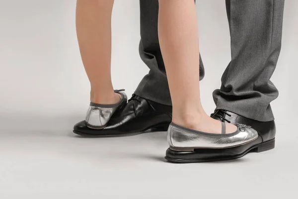 Legs Father His Little Daughter Dancing Grey Background — Stock Photo, Image