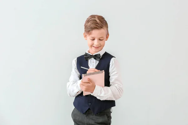 Cute Little Waiter Notebook Light Background — Stock Photo, Image