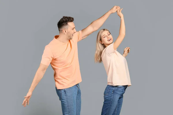 Happy Dancing Young Couple Grey Background — Stock Photo, Image