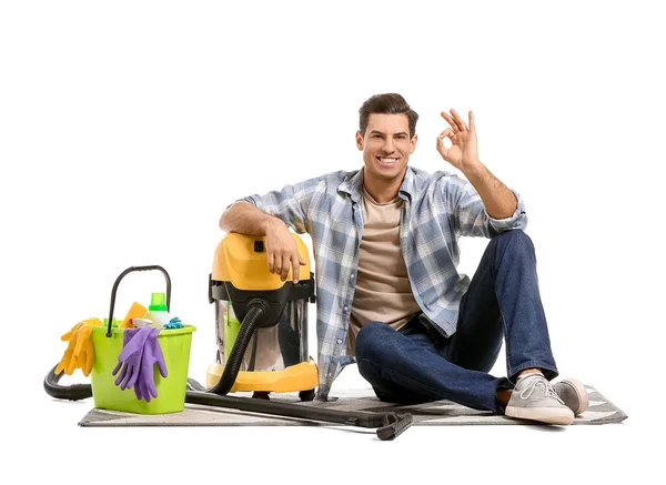 Young Man Vacuum Cleaner Sitting Carpet White Background — Stock Photo, Image
