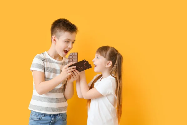 Cute Little Children Eating Chocolate Color Background — Stock Photo, Image