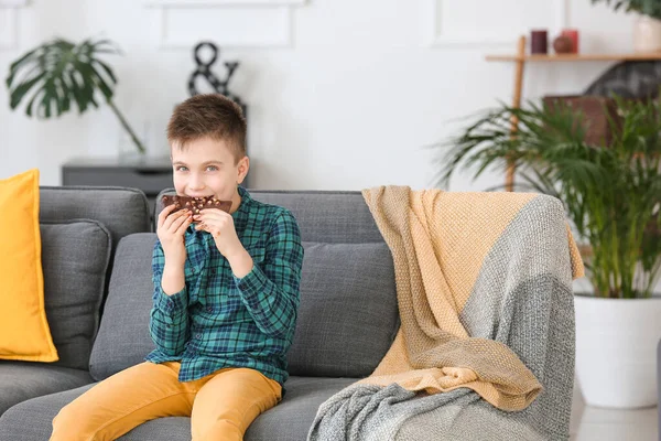 Cute Little Boy Eating Chocolate Home — Stock Photo, Image