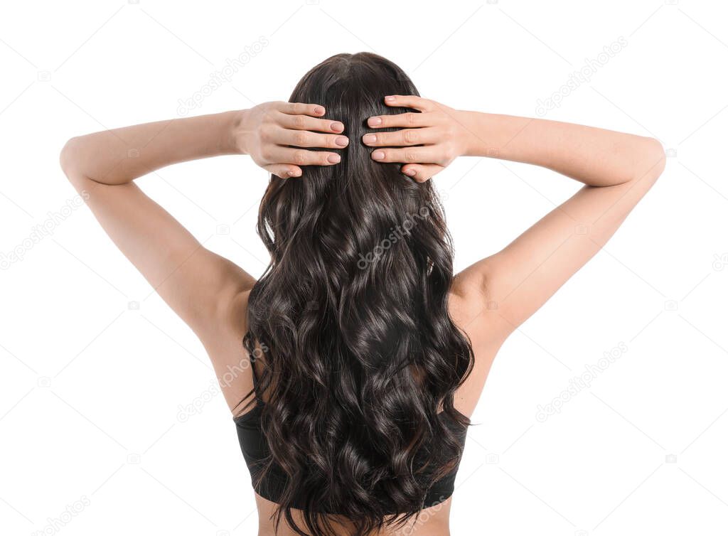 Young woman with beautiful healthy hair on white background