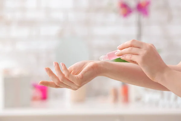 Woman Applying Roll Perfume Home — Stock Photo, Image