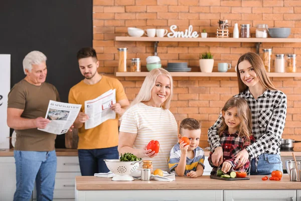 Big family cooking together in kitchen